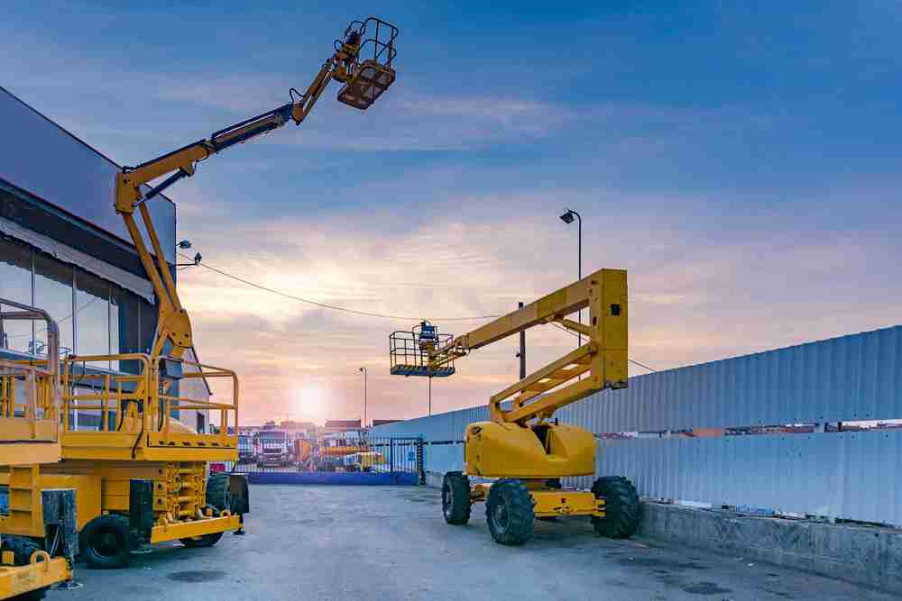 construction equipment on a job site waiting to be transported to multiple locations safely and efficiently