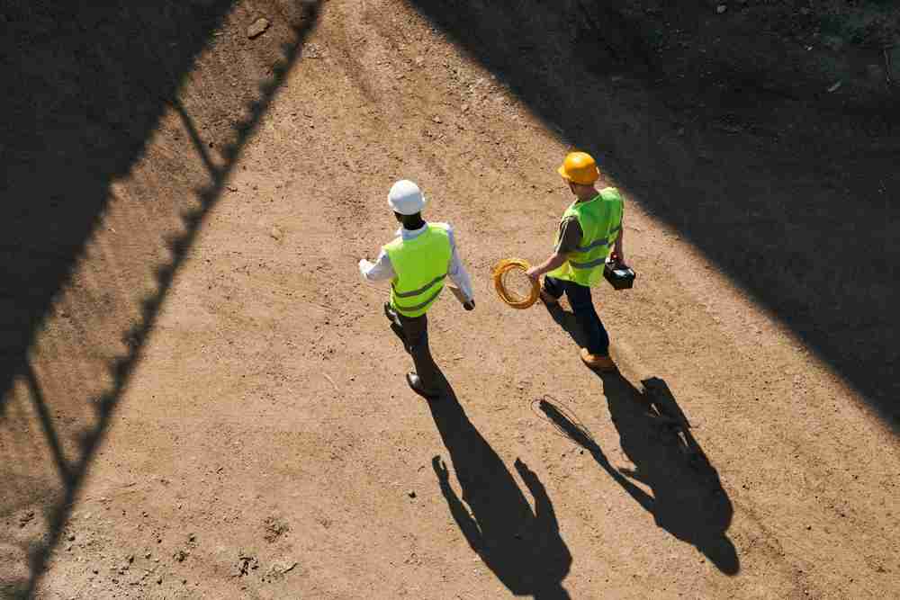 construction workers in heat working on a roof during the summer during extreme hot temperatures