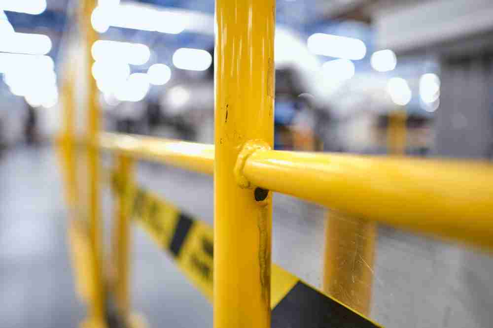 safety rail for construction site to protect workers from accidents falls and slips with a guardrail system