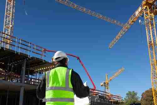 construction workers wearing reflective vests during the day to protect themselves from accidents and dangers