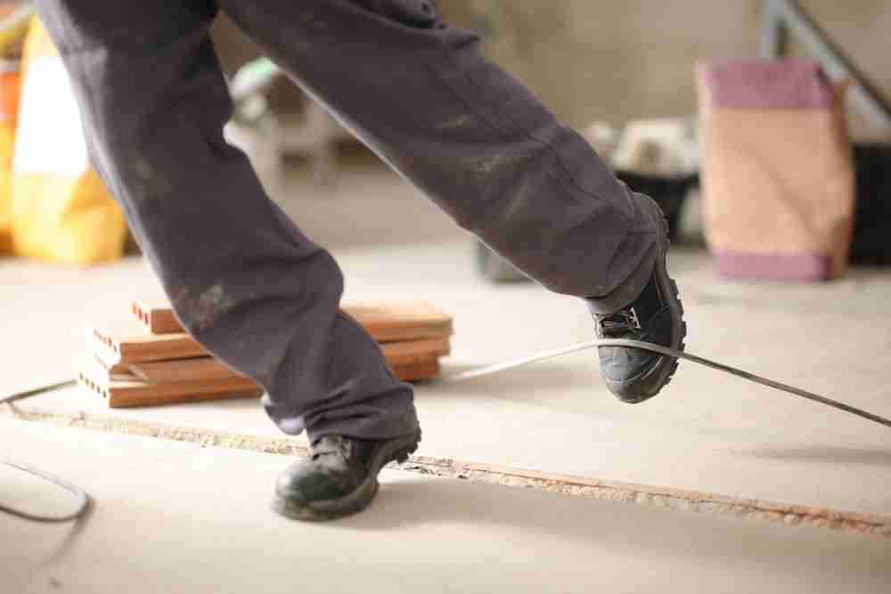 construction worker tripping on uneven floor surface