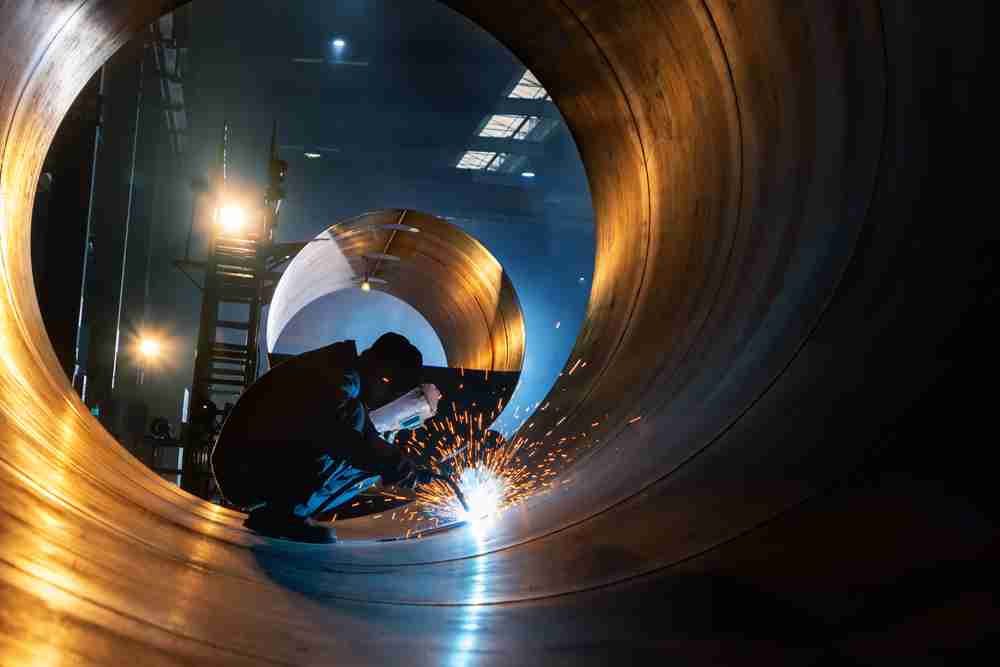 construction worker using welding equipment from leister for a commercial construction project