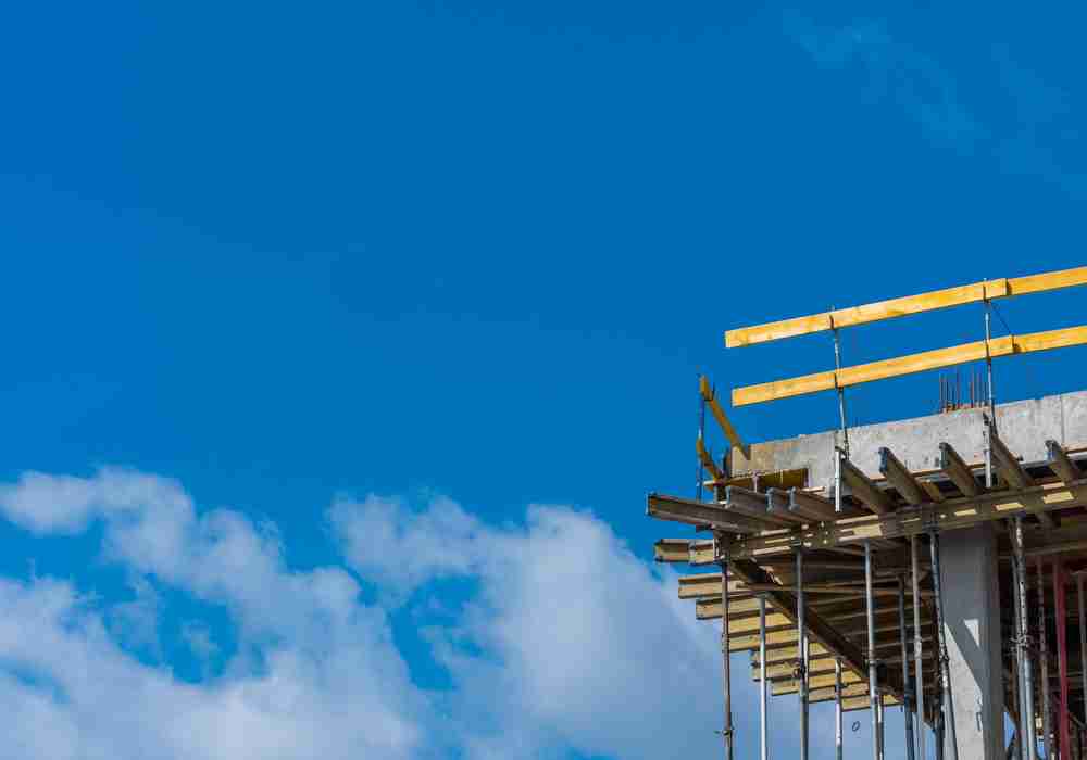 slab grabber keeping safety guardrail attached to concrete construction site