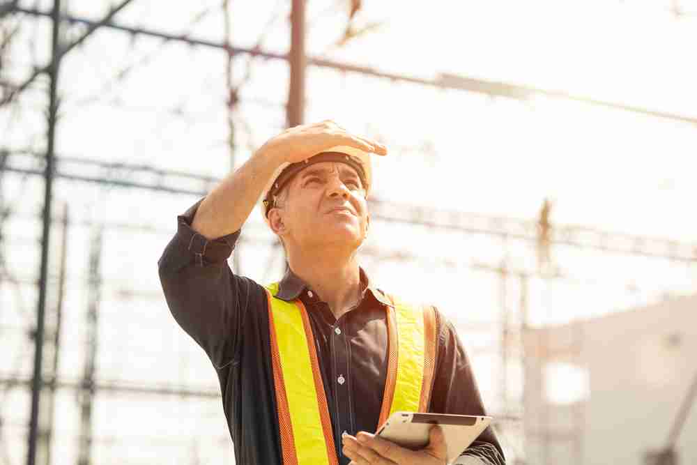 construction worker in the heat in sun in somewhere warm like florida following safety equipment and tips